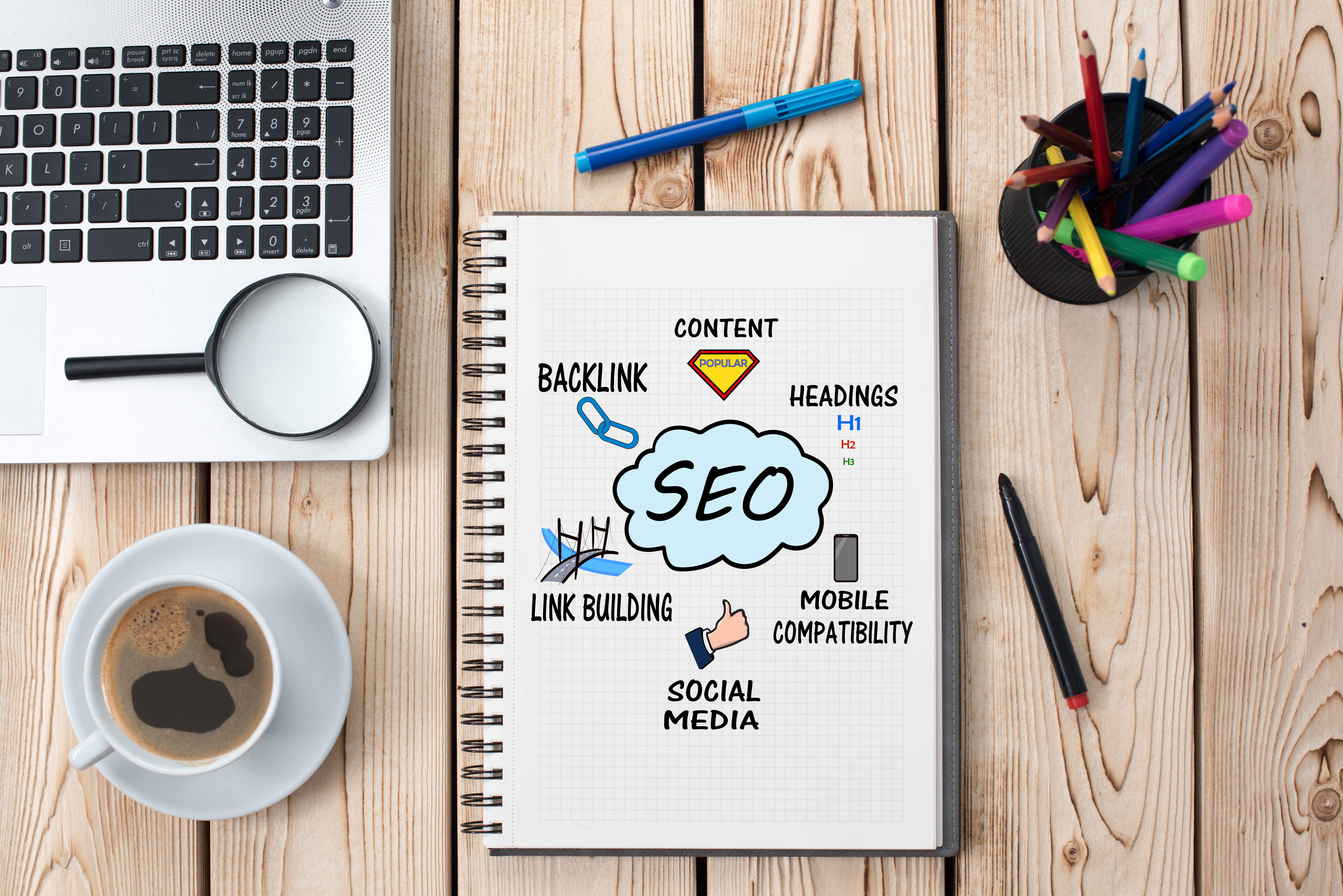 Office desk with SEO written on a book